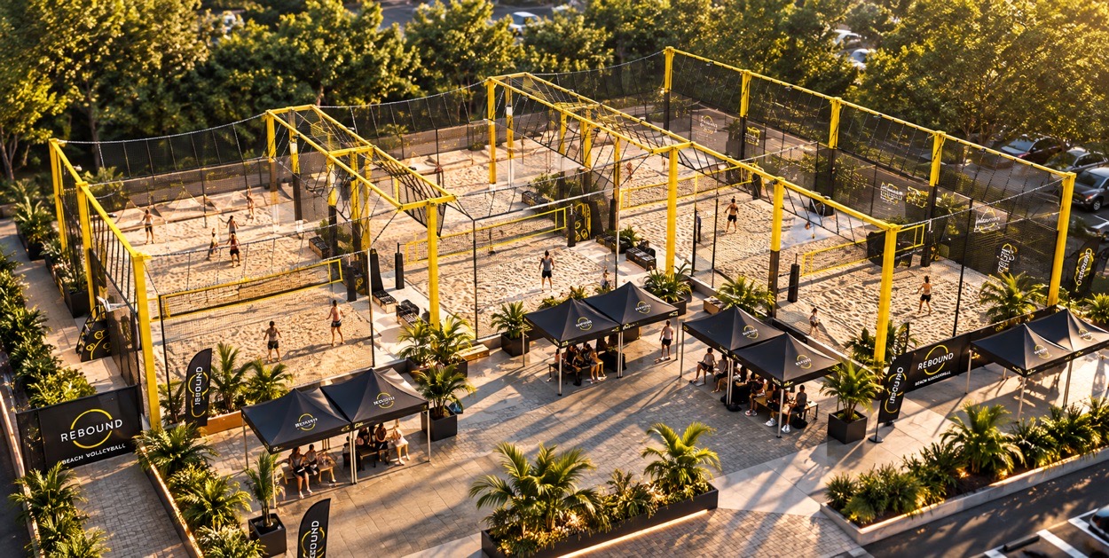 Aerial vision of the future Quicksand venue with four rebound beach volleyball courts and courtside spectator spaces